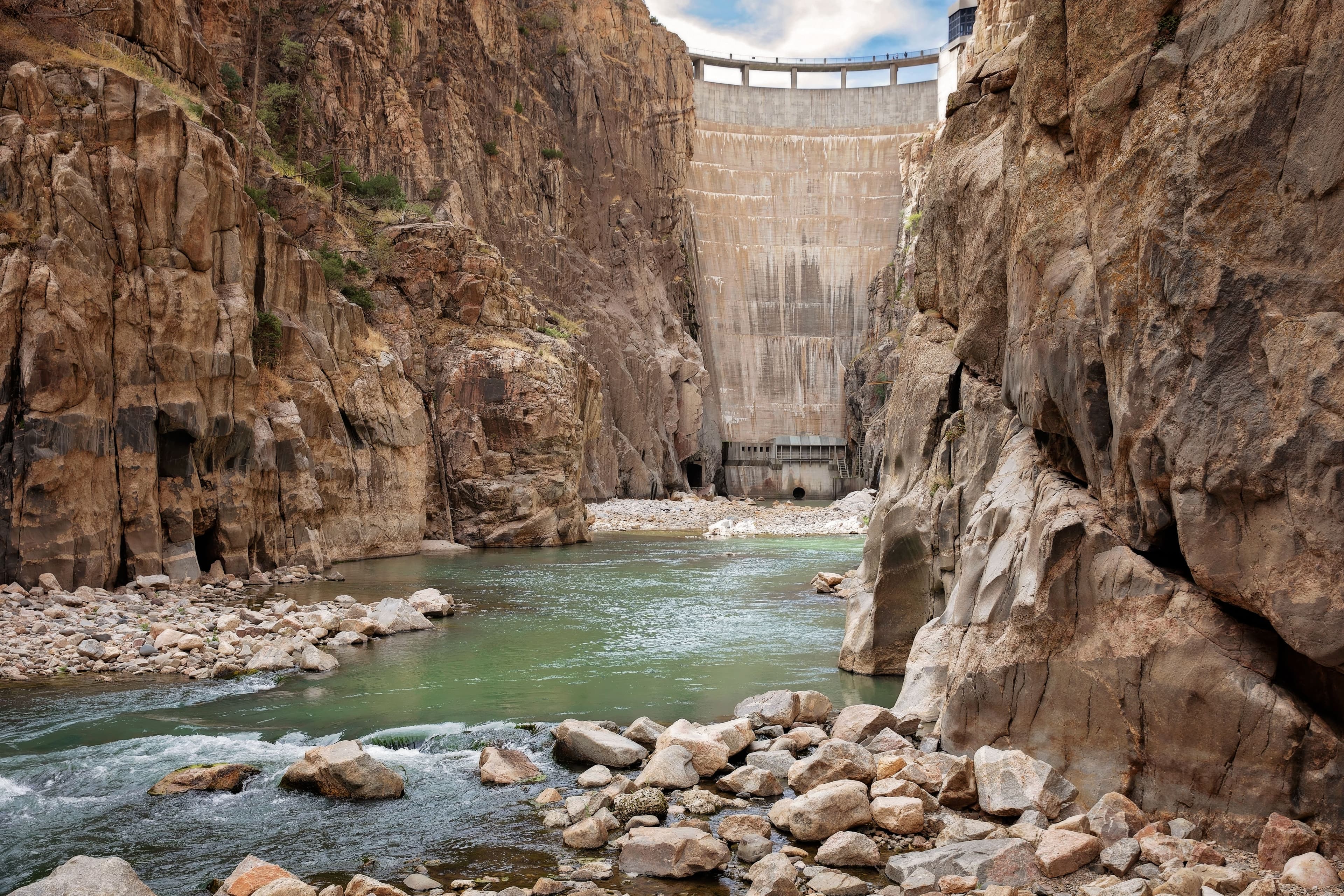 Concrete dam built in a rocky gorge